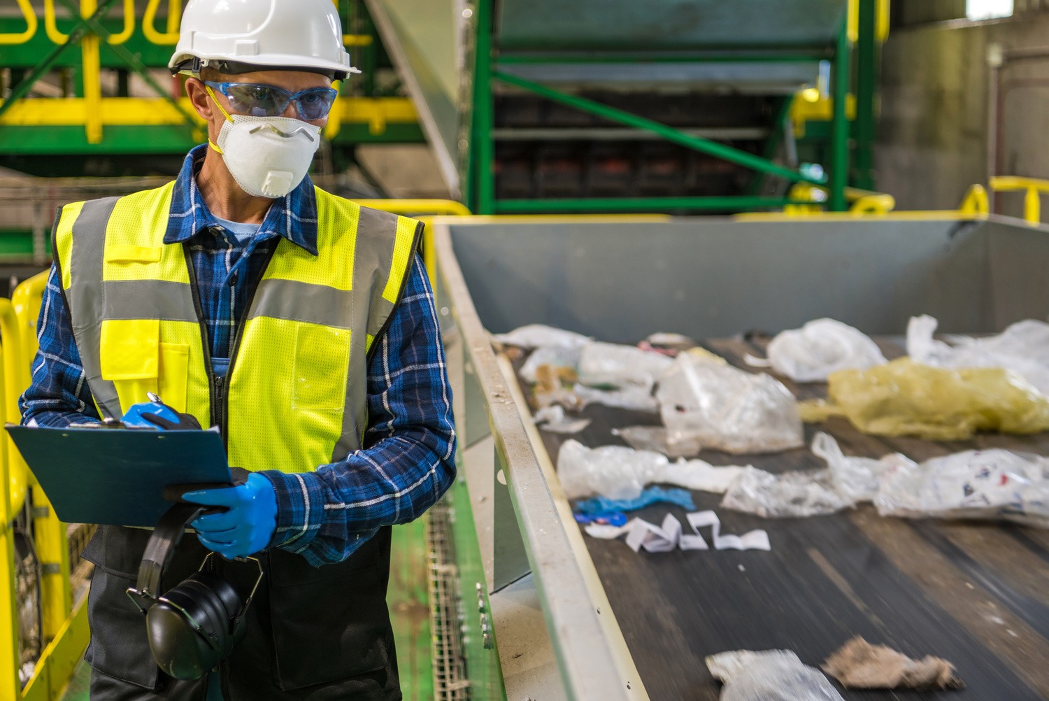 GGC team member sorting waste